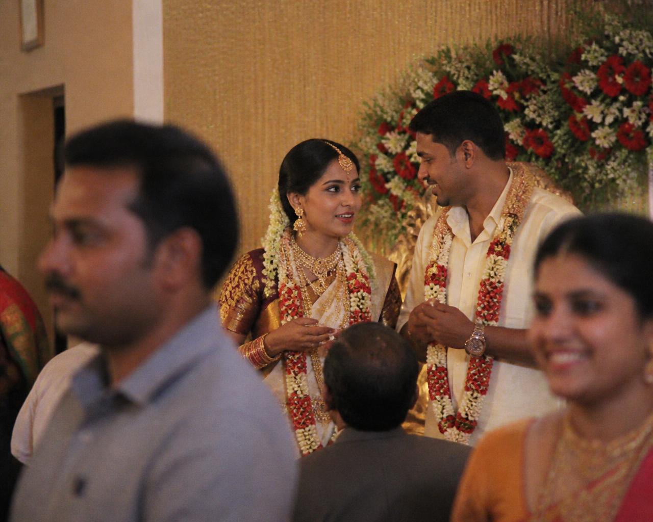 Wedding reception stage with the couple under warm lighting